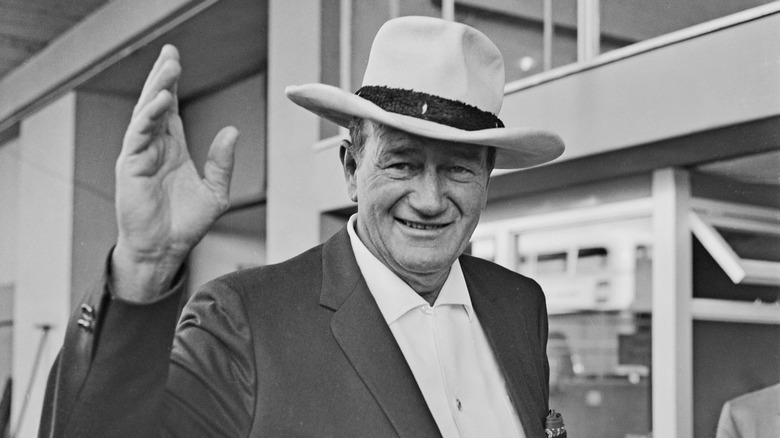John Wayne waving in Stetson