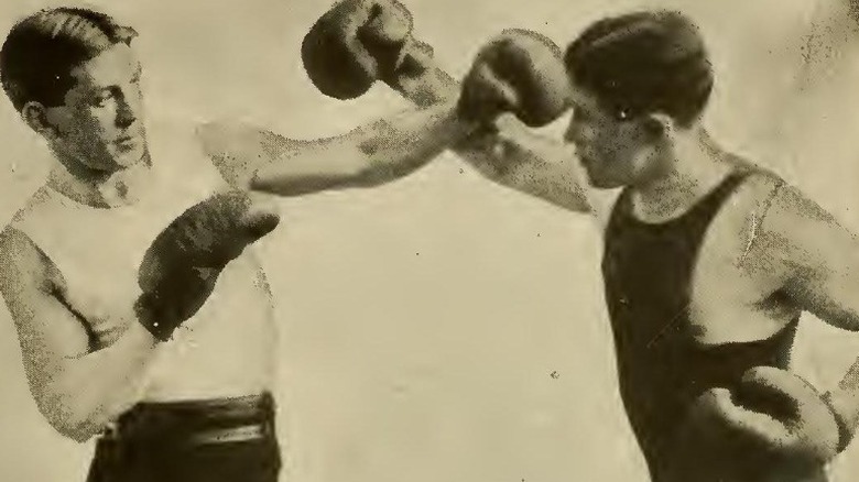 19th Century boxer parries his opponent's punch