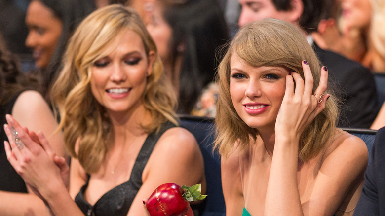 Karlie Kloss and Taylor Swift at am event