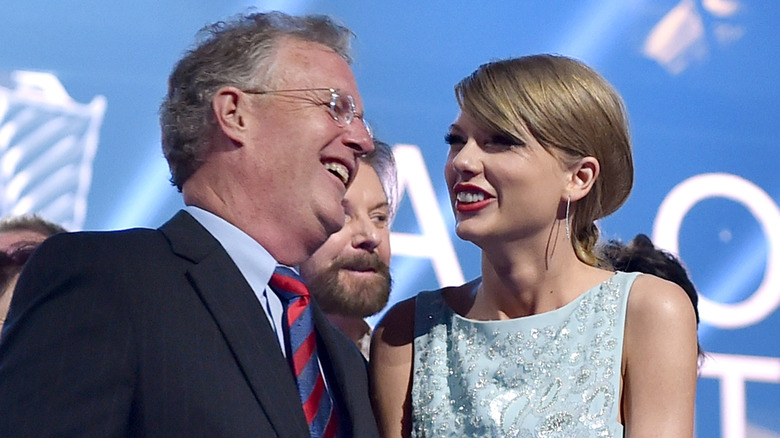 Scott Swift and Taylor Swift talking and laughing 