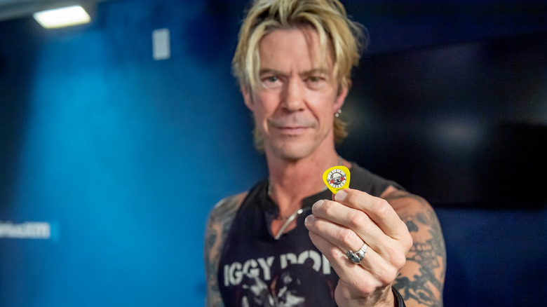 Duff McKagan holding guitar pick