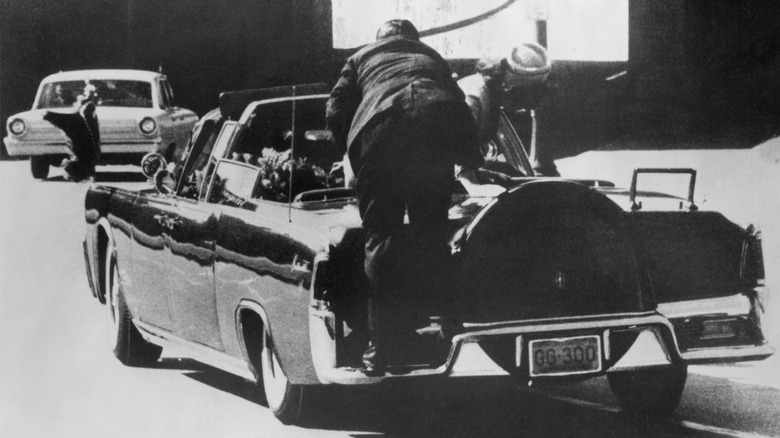 Kennedy assassination Clint Hill on the car