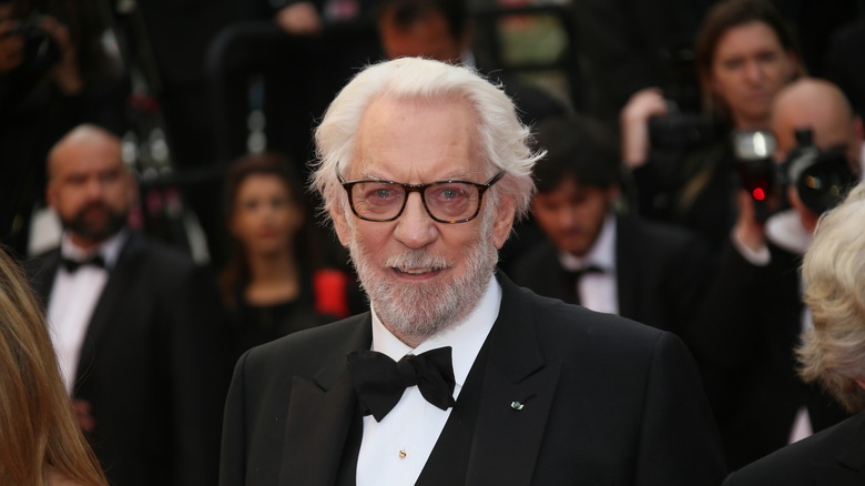 donald sutherland suit glasses staring