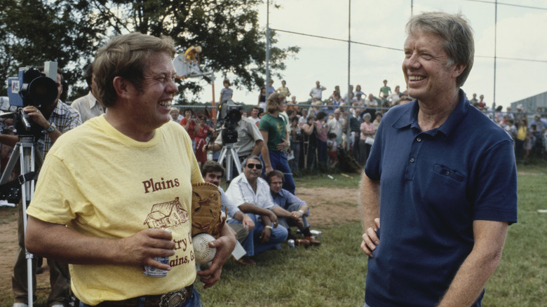 jimmy and billy carter smiling at softball game