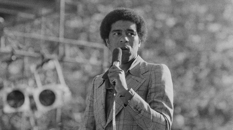 Richard Pryor onstage with microphone