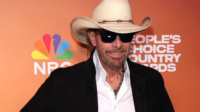 Toby Keith hat sunglasses smiling NBC event