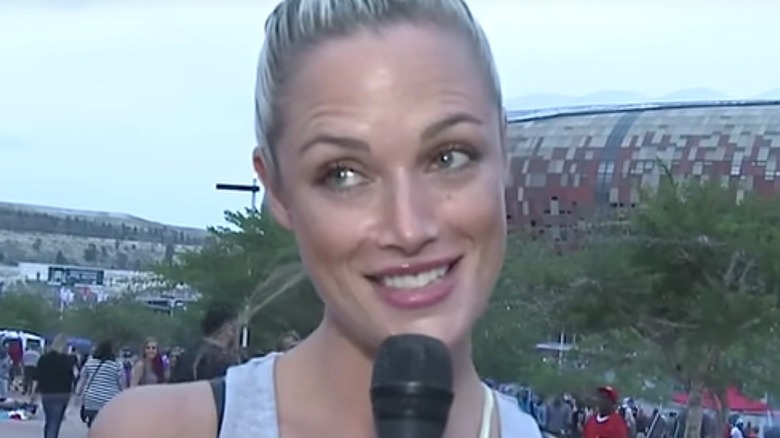 Reeva Steenkamp on TV smiling microphone