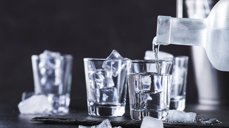 Vodka being poured into shotglass