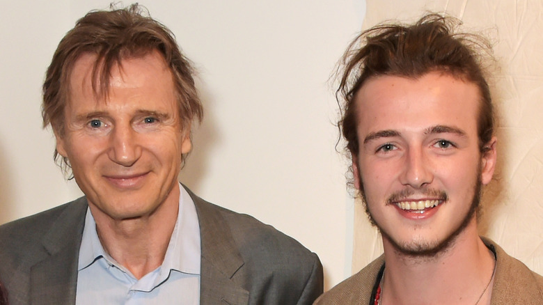 Liam Neeson and son Micheal smiling