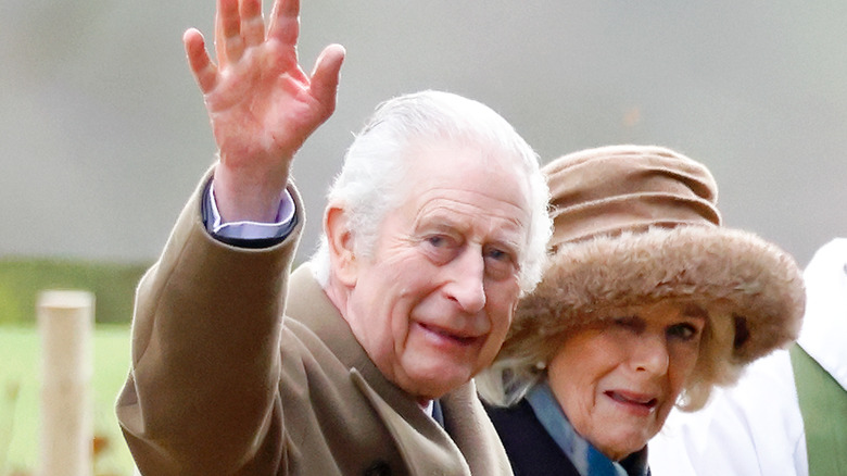 Charles III waving on walk with Camilla