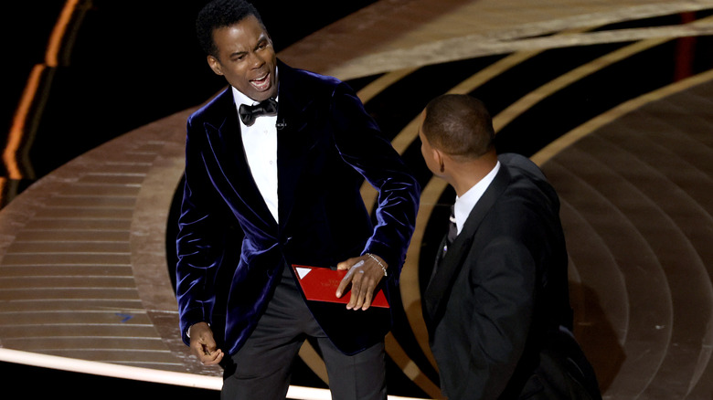 Chris Rock and Will Smith arguing on stage