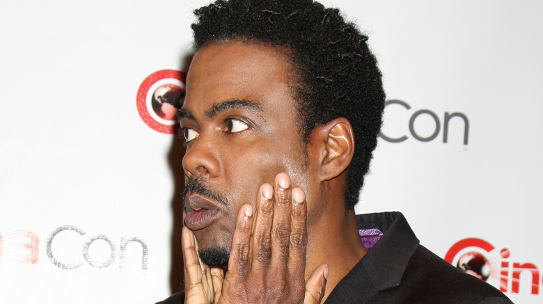Chris Rock with hands on face