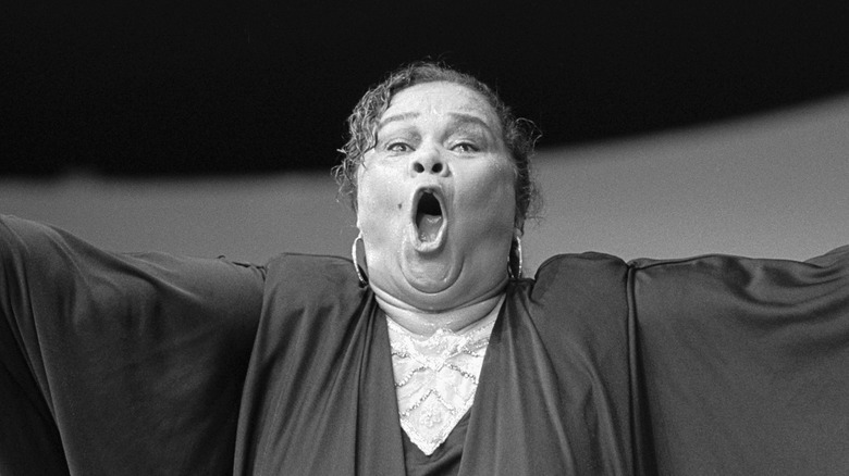 Black and white photo of Etta James singing 