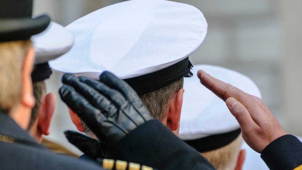 Navy soldiers saluting