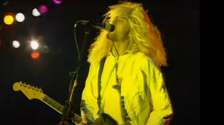 Cobain in a wig singing
