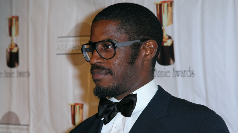 Ahmed Best black tuxedo and glasses at event