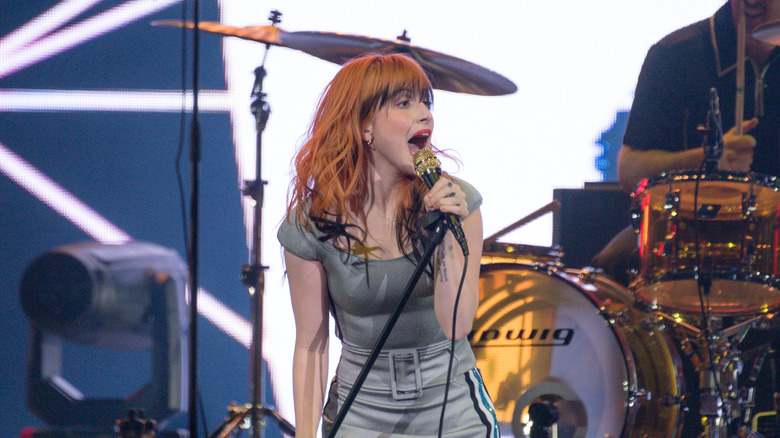 Williams orange hair singing onstage