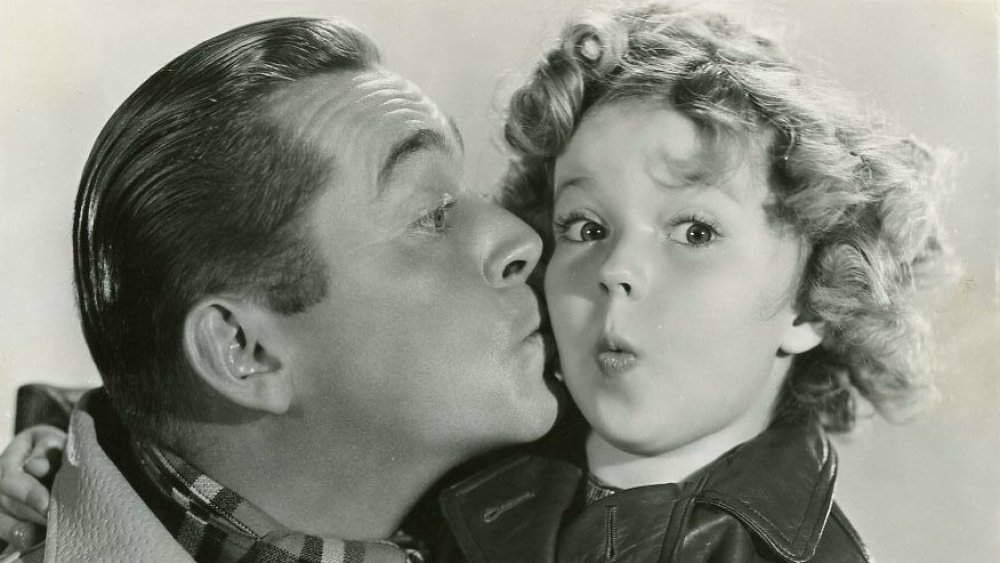 Publicity photo of James Dunn and Shirley Temple in the 1934 film "Bright Eyes"