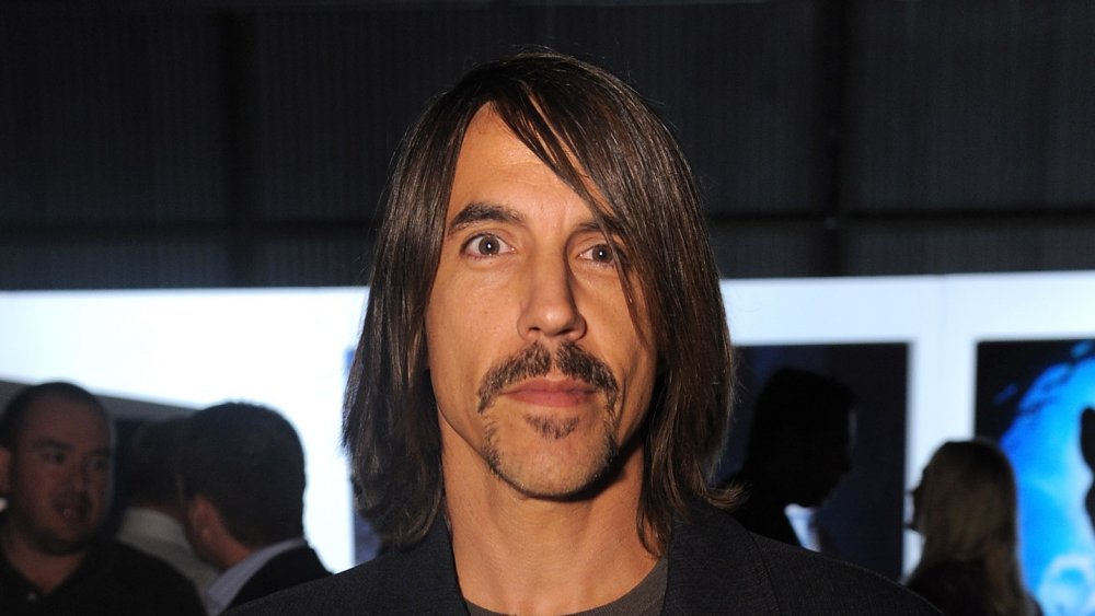 Anthony Kiedis staring at camera smirking