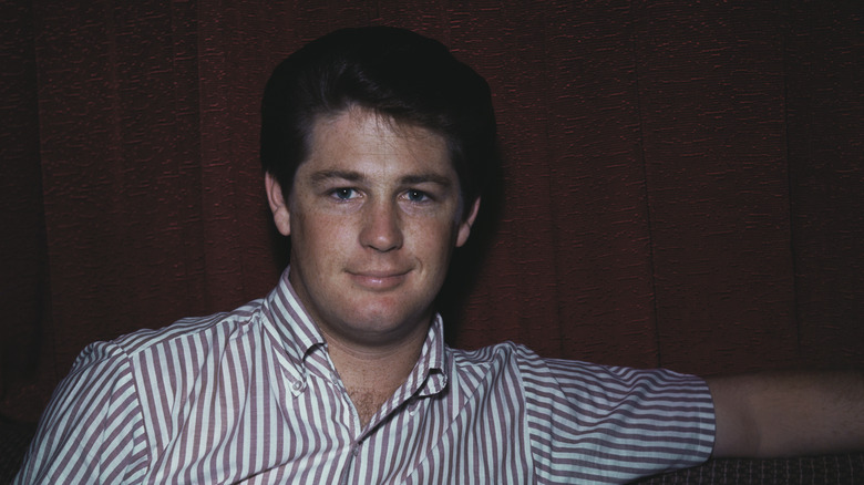 Young Brian Wilson in striped shirt