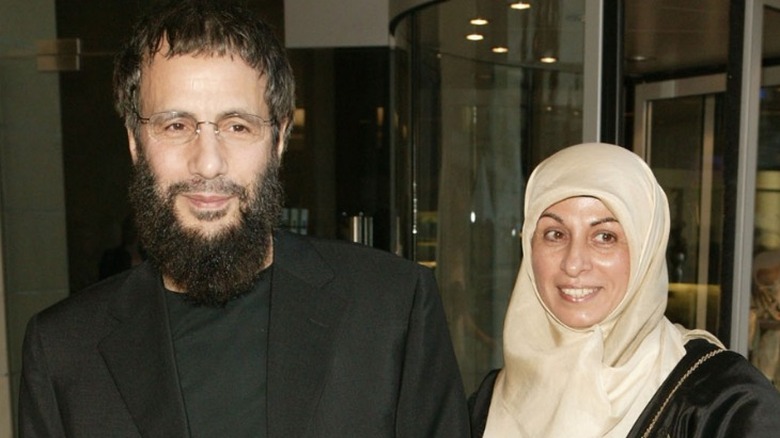 Cat Stevens/Yusuf Islam posing with his wife Fauzia in 2003