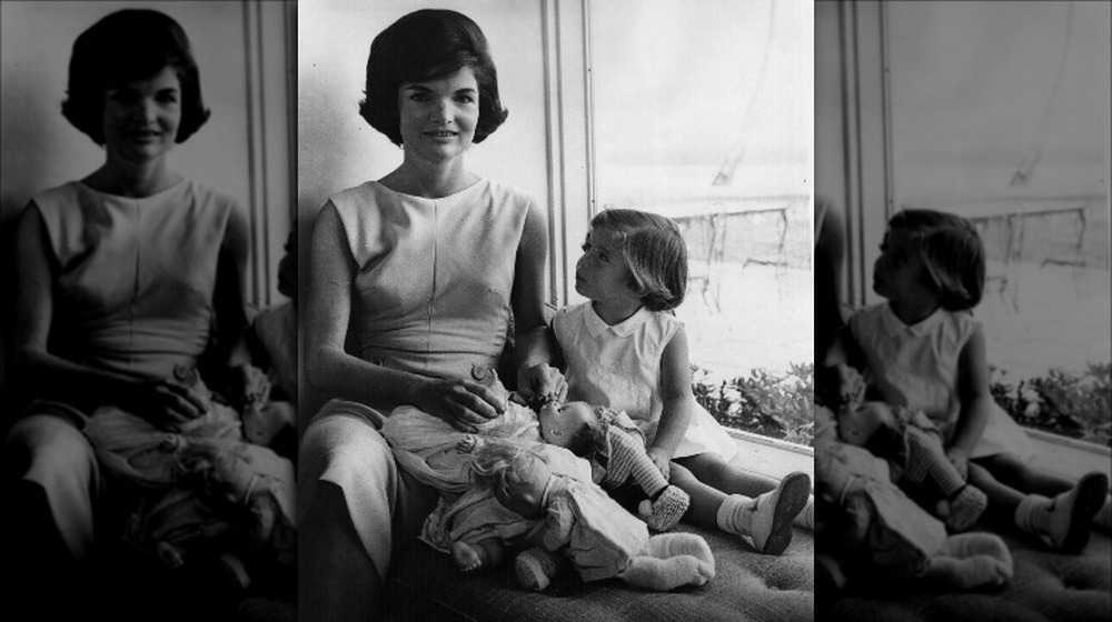 Jacqueline Kennedy sitting with daughter Caroline