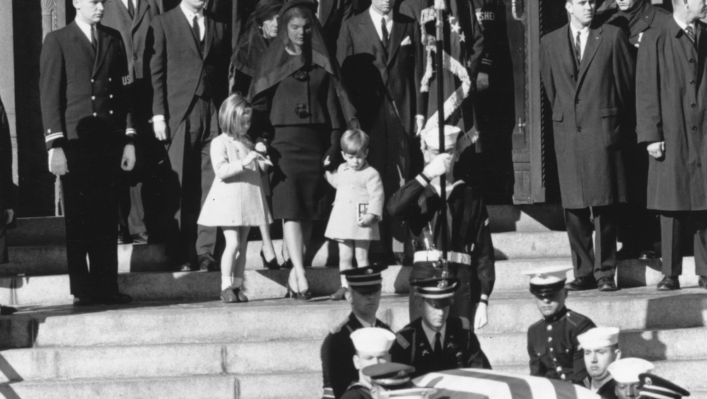 Jackie Kennedy walking down steps with her two children at funeral of President John F. Kennedy