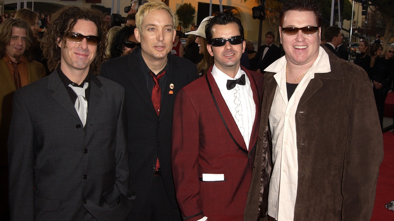 Smash Mouth at event suits sunglasses