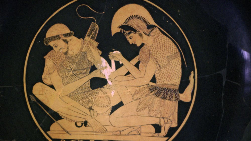 Greek vase painting of Achilles and Patroclus, where Achilles is binding the wounds of Patroclus.