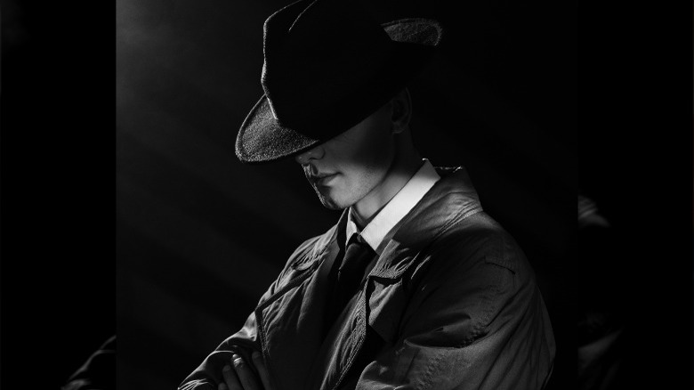 black and white spy with hat