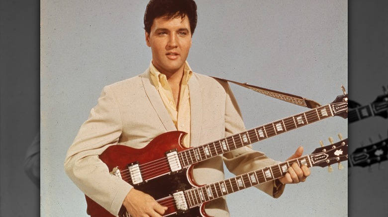 Elvis Presley playing guitar