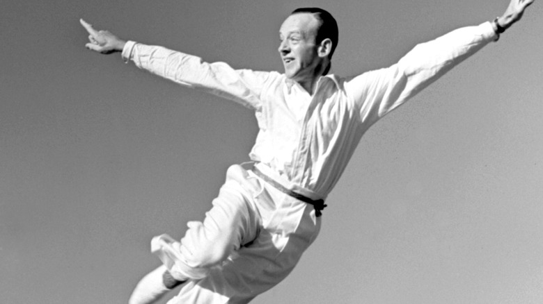Fred Astaire leaps through air