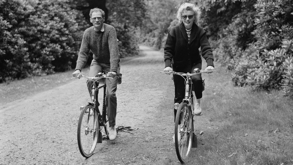 Marilyn Monroe and Arthur Miller riding bikes