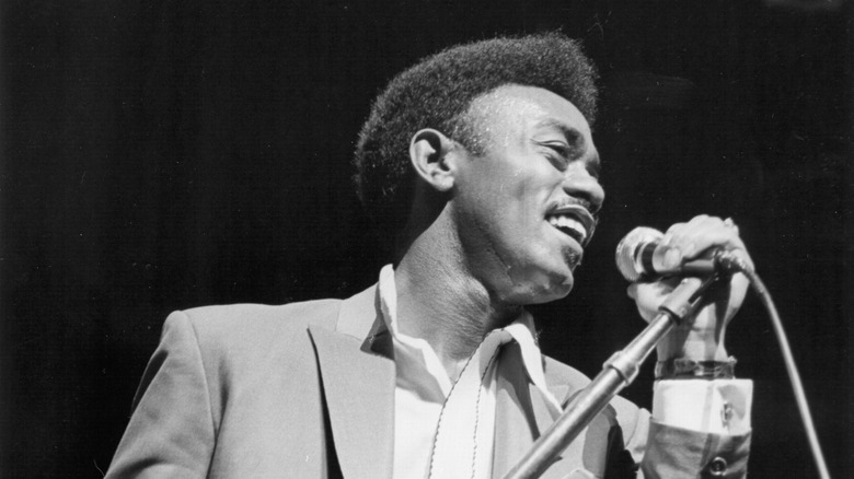 Johnnie Taylor with a microphone
