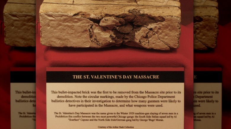 brick for the massacre site showing bullet hole