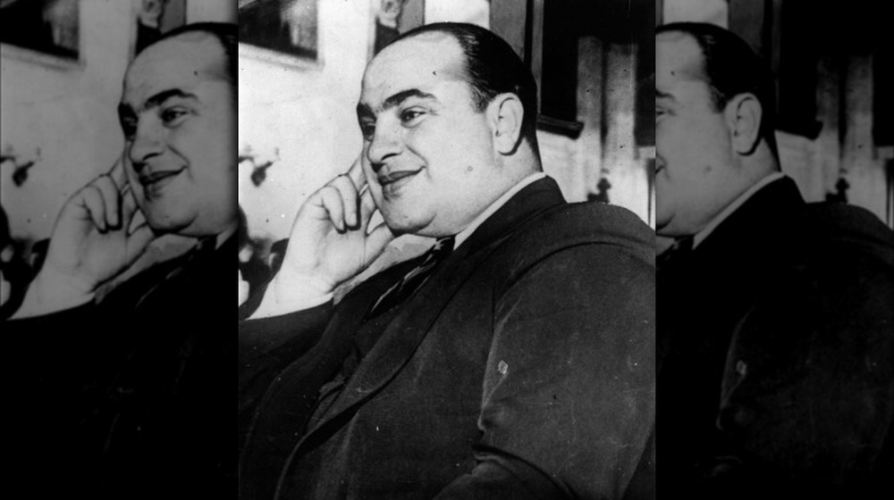 Al Capone hand on face