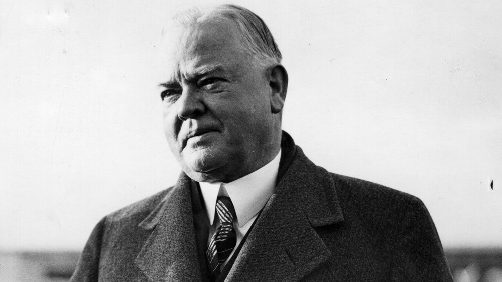 US president Herbert Hoover squinting