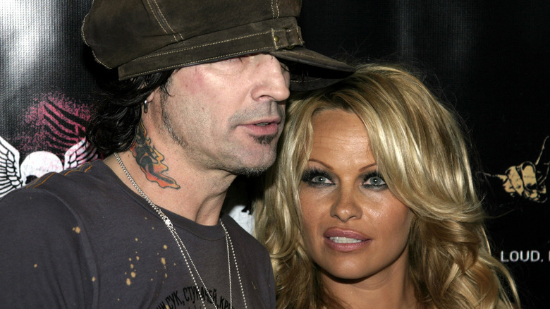 Pamela Anderson, Tommy Lee looking away from camera