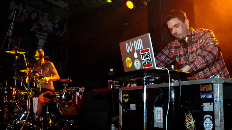 Travis Barker and DJ AM performing