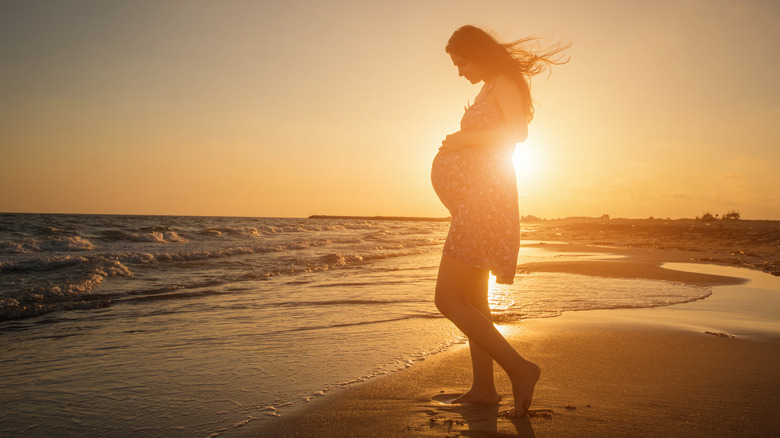 Pregnant woman at the beach