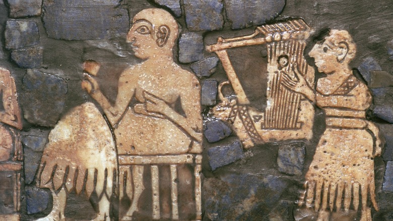 mesopotamian relief man seated