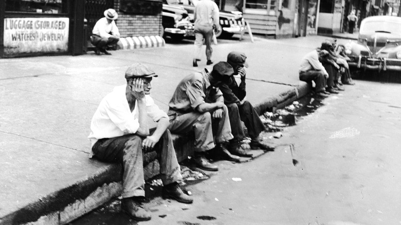 People sitting on street corner
