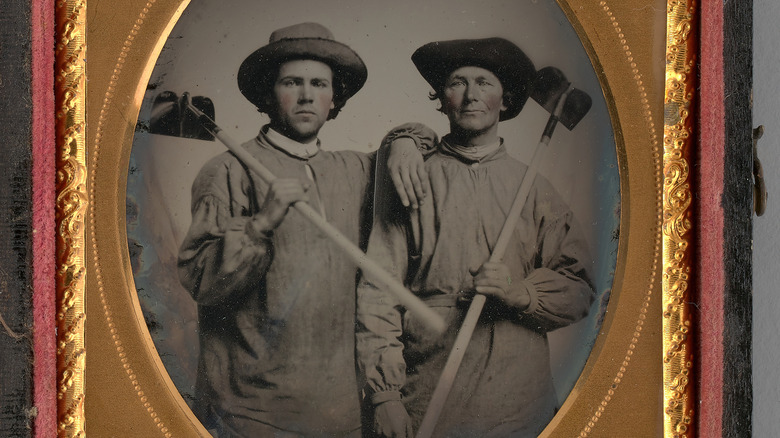 Two men pose together, 1868