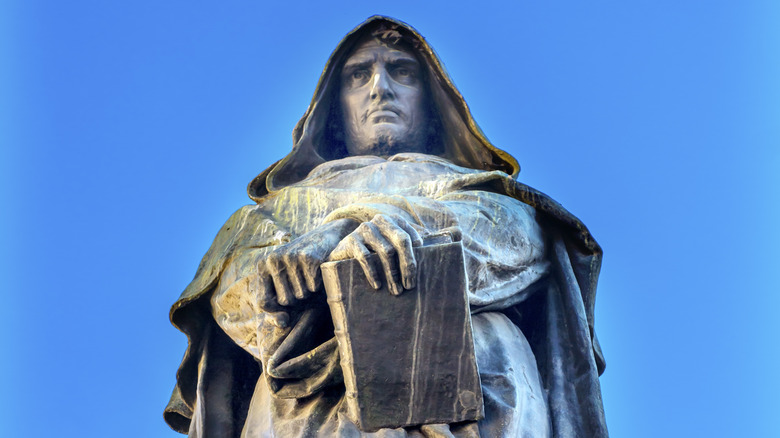 statue of Giordano Bruno under blue sky