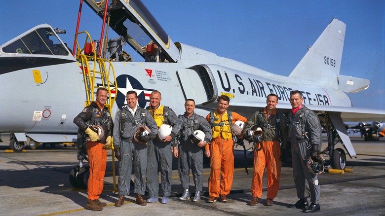 Mercury 7 group with aircraft