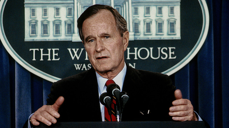 President George H. W. Bush takes questions from the briefing room