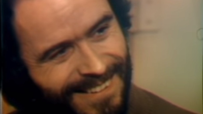 Ted Bundy smiling in a 1977 prison interview