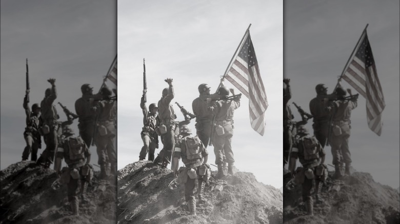 US soldiers raise the flag, 1944