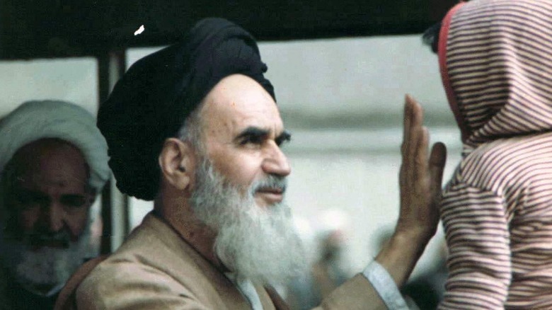 Khomeini holding child