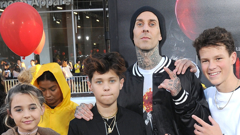 Travis Barker and family posing